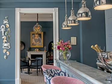 Bistro and bar with stone blue and blush pink interior