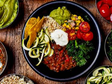 Colourful spread of beans, pulses, dips and vegetables