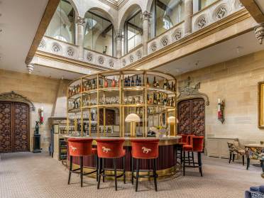 Island bar under grand stairwell