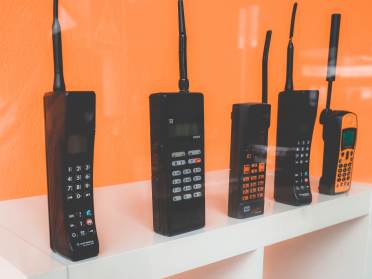 Chunky old mobiles on a display