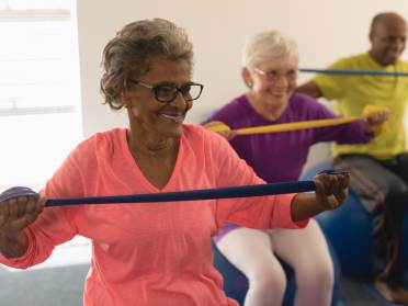 Older people fitness class on exercise balls