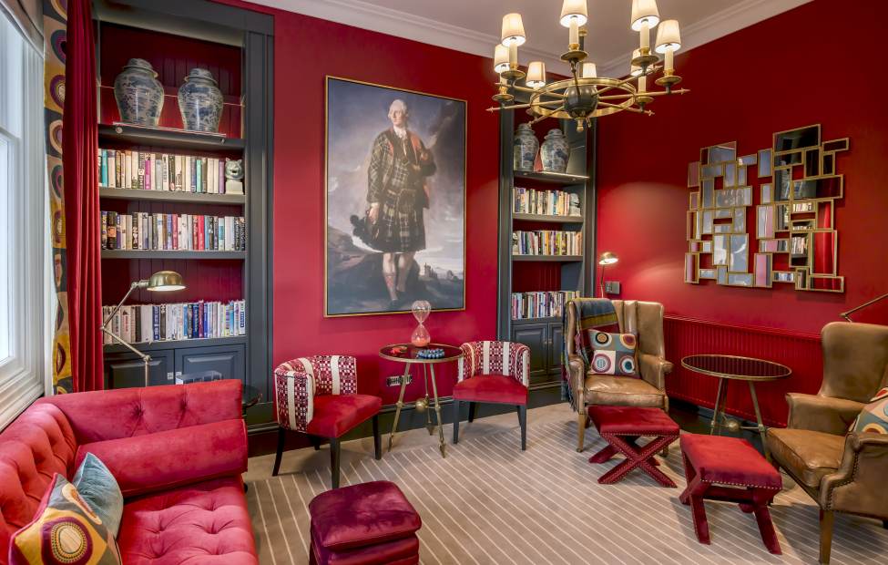 Luxury lounge with bookshelves and chandelier