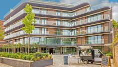 Exterior of a glass building with apartments