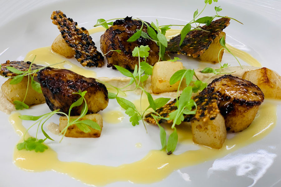 Seared scallops, miso glaze, sesame puree, turnip, and verjus cream