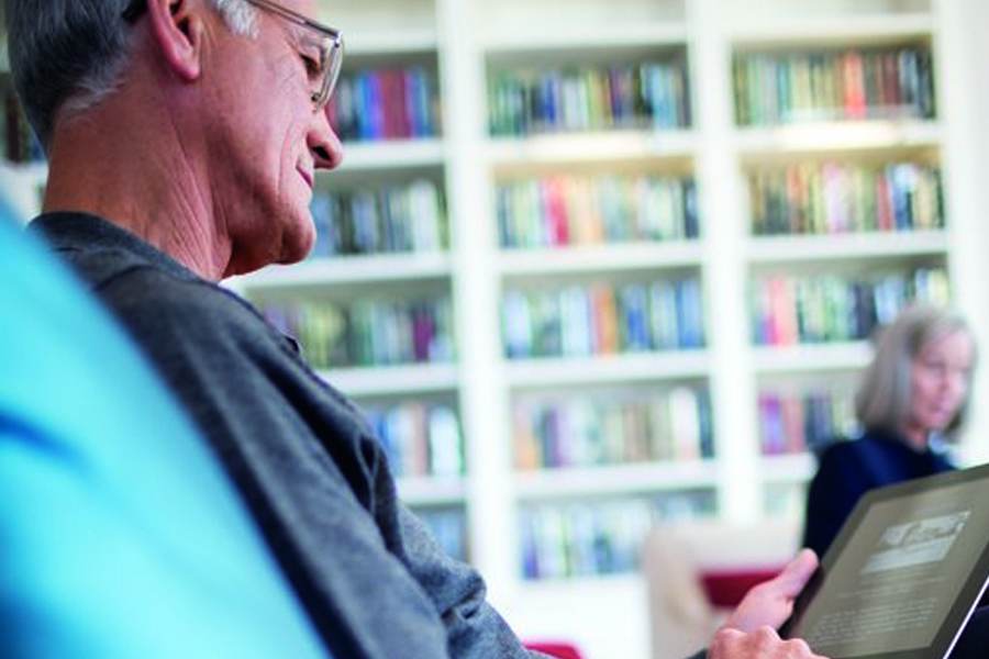 A reading man in a library